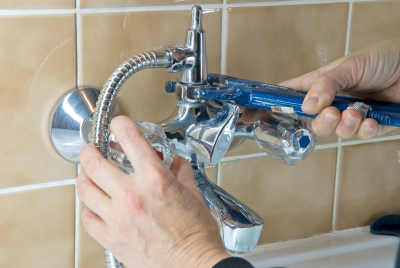 Shower being installed in a Feltham bathroom